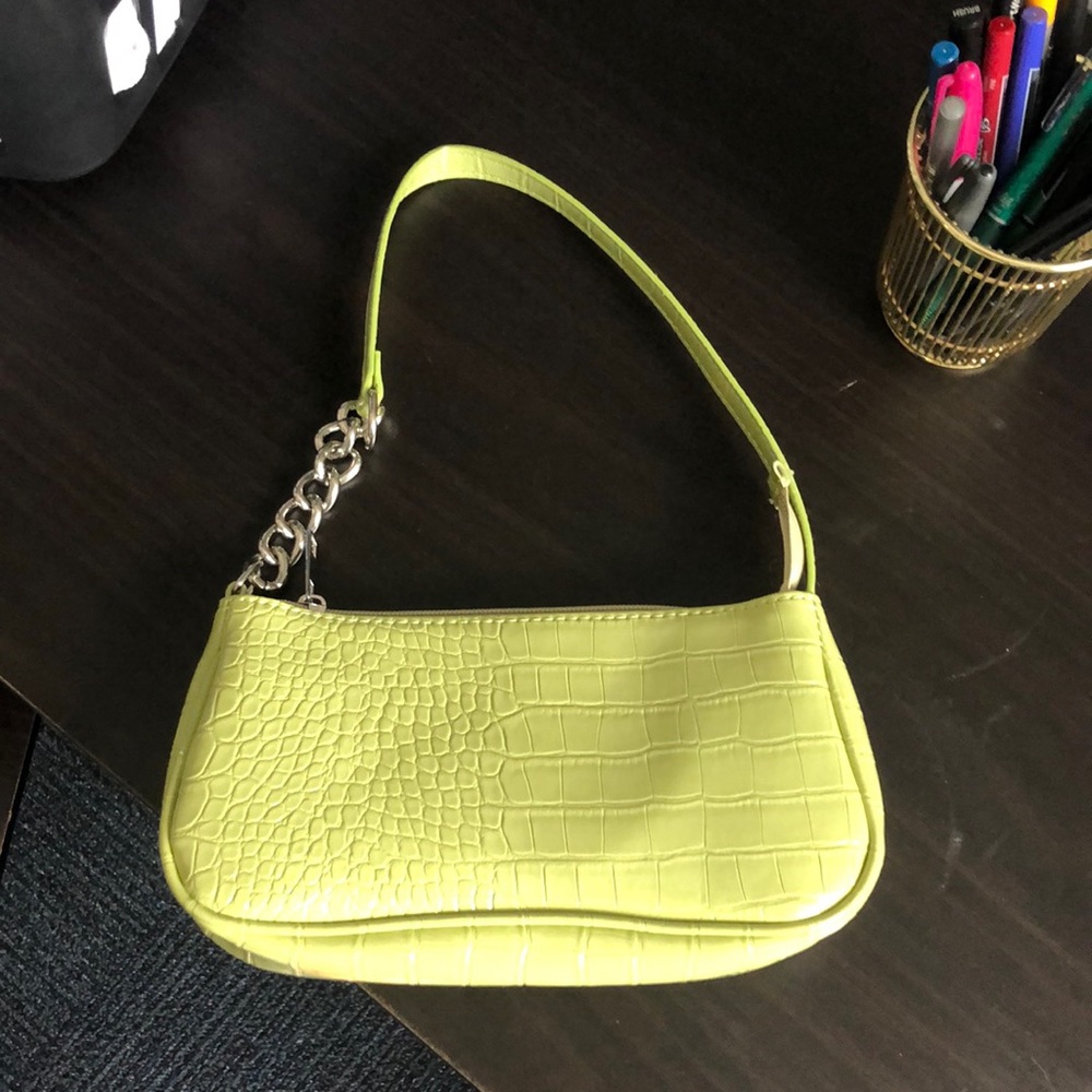 I’m selling a never used snakeskin small bag